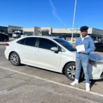 Happy student with license after driving lessons Oakville, Oakville Heights.