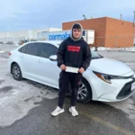 Joyful learner with license at driving school Oakville, Downtown West Oakville.