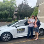 Successful student with driving license at driving school Oakville, North Oakville.